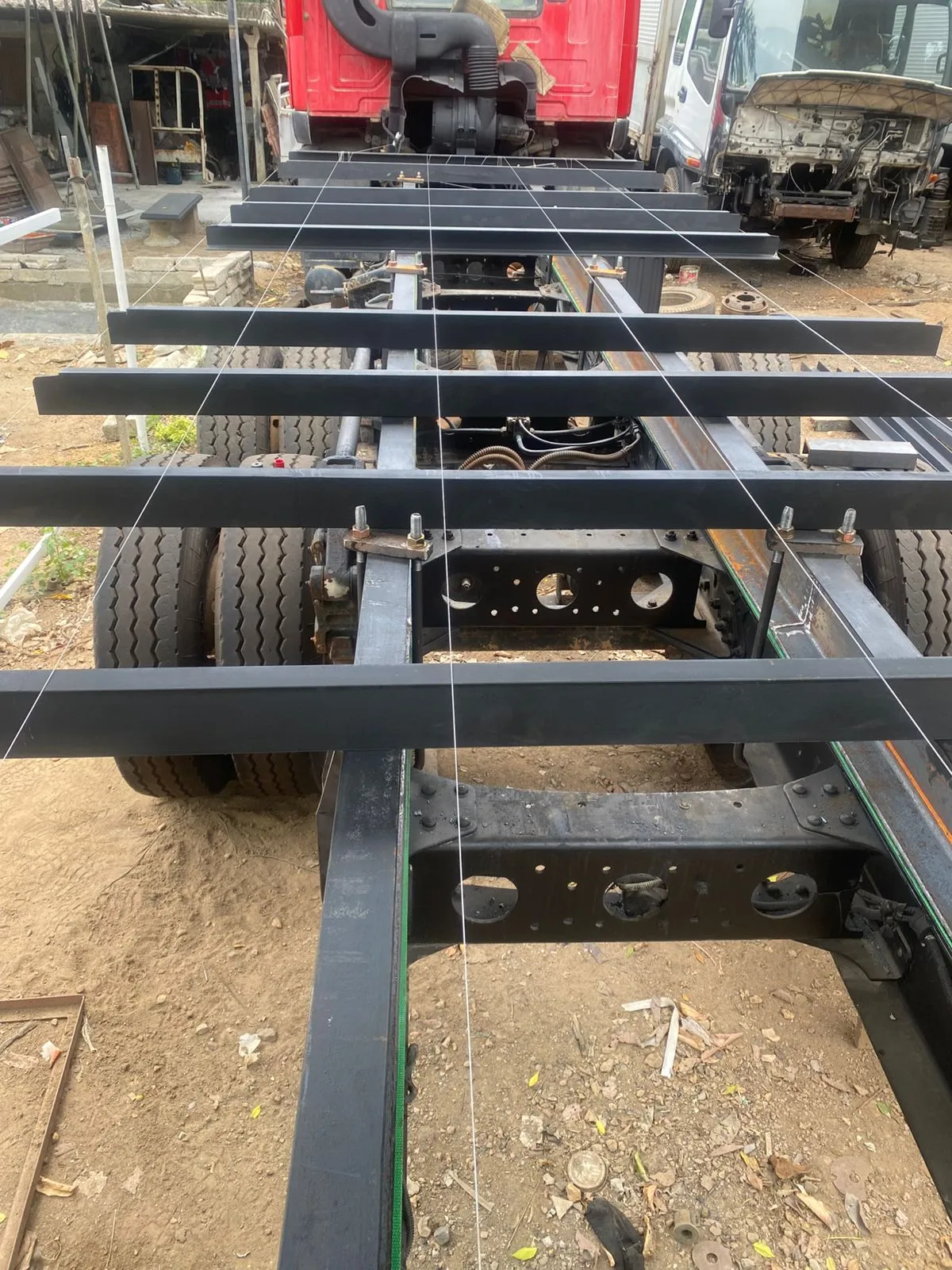 Chassis cross members aligned with precision string lines