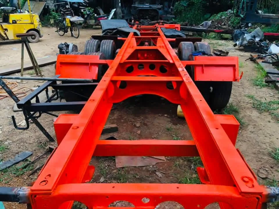 Freshly painted red chassis frame — completed repair