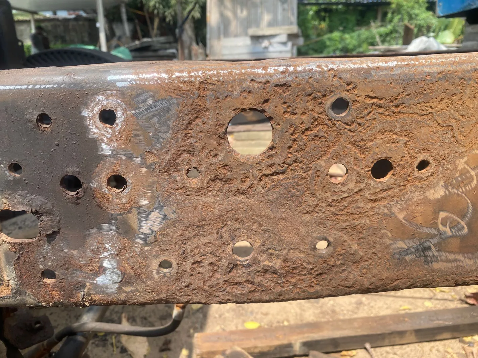 Close-up of chassis corrosion damage