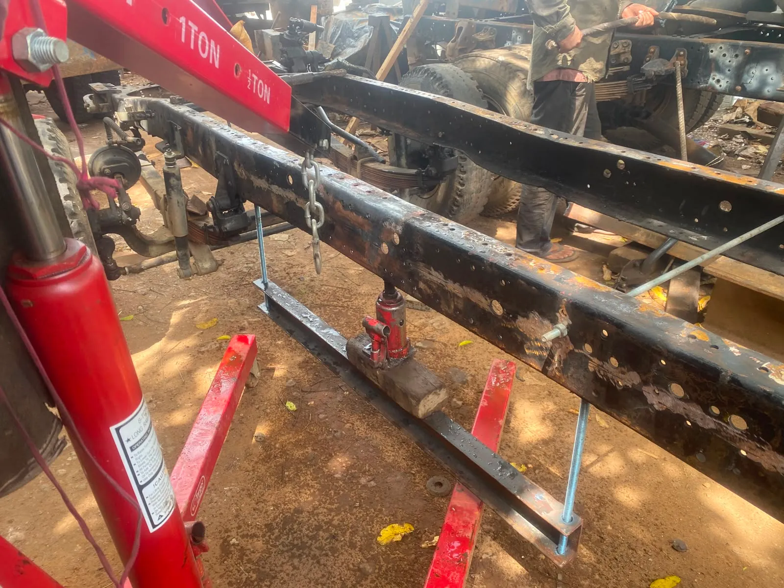 Hydraulic press straightening chassis rail